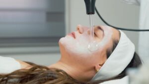 woman getting a high frequency treatment done