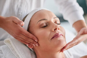 Shot of a mature woman getting a facial treatment at a spa